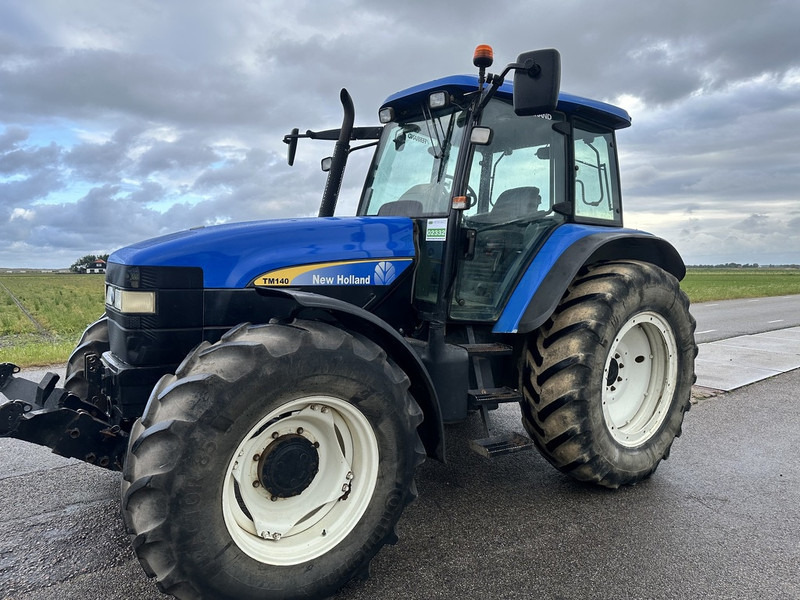 New Holland TM 140 - Tractor: foto 1 New Holland TM 140 - Tractor: foto 1