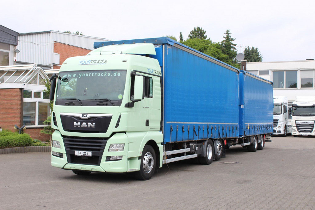 MAN TGX 26.460 Retarder Jumbo-Zug 120M3 Durchlade - Camión lona: foto 1 MAN TGX 26.460 Retarder Jumbo-Zug 120M3 Durchlade - Camión lona: foto 1