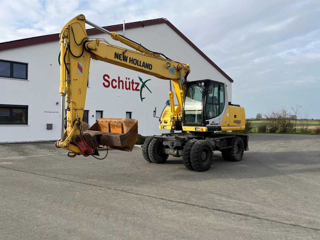 New Holland MH 5.6 inkl. Grabenlöffel, Tieflöffel - Excavadora de ruedas: foto 1 New Holland MH 5.6 inkl. Grabenlöffel, Tieflöffel - Excavadora de ruedas: foto 1