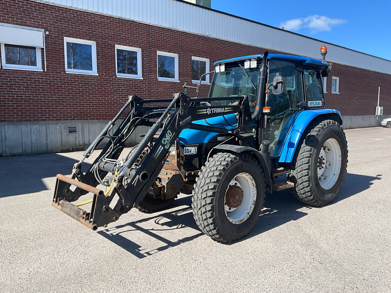 New Holland TL90 - Tractor: foto 1 New Holland TL90 - Tractor: foto 1