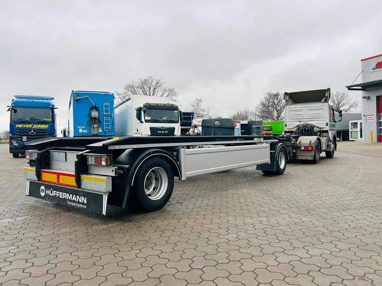 Hüffermann HAR 20.70 LS Aussenrollen Anhänger Sofort Verfüg - Remolque multilift/ Portacontenedores de cadenas: foto 2 Hüffermann HAR 20.70 LS Aussenrollen Anhänger Sofort Verfüg - Remolque multilift/ Portacontenedores de cadenas: foto 2