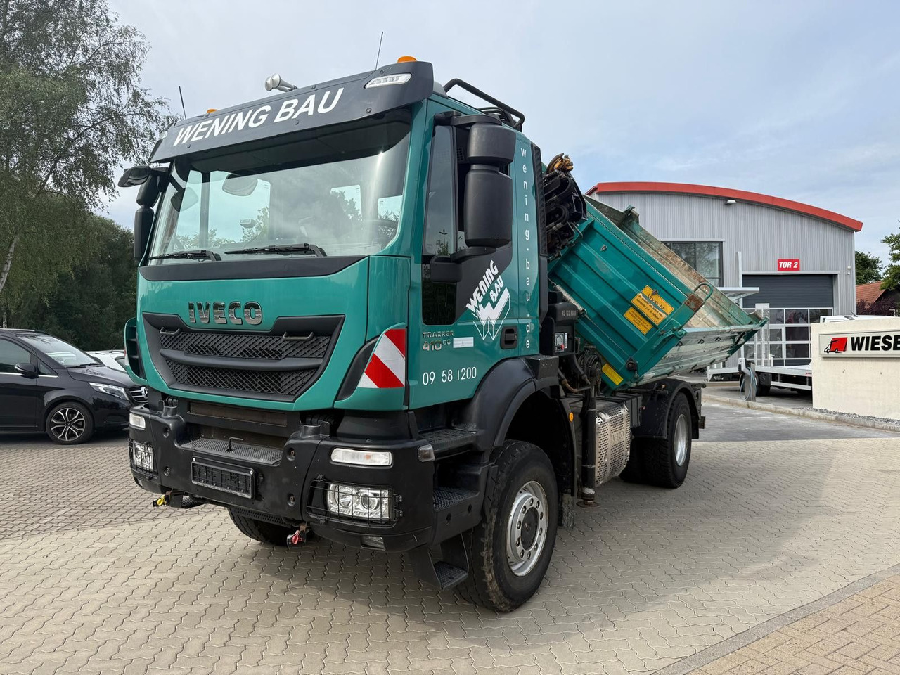Iveco AD190 T/W Trakker 410 4x4 Allrad Kran KipperHIAB - Camión volquete, Camión grúa: foto 1 Iveco AD190 T/W Trakker 410 4x4 Allrad Kran KipperHIAB - Camión volquete, Camión grúa: foto 1