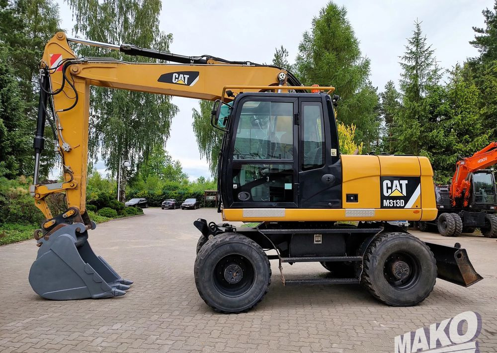 Caterpillar M313D - Excavadora de ruedas: foto 1 Caterpillar M313D - Excavadora de ruedas: foto 1