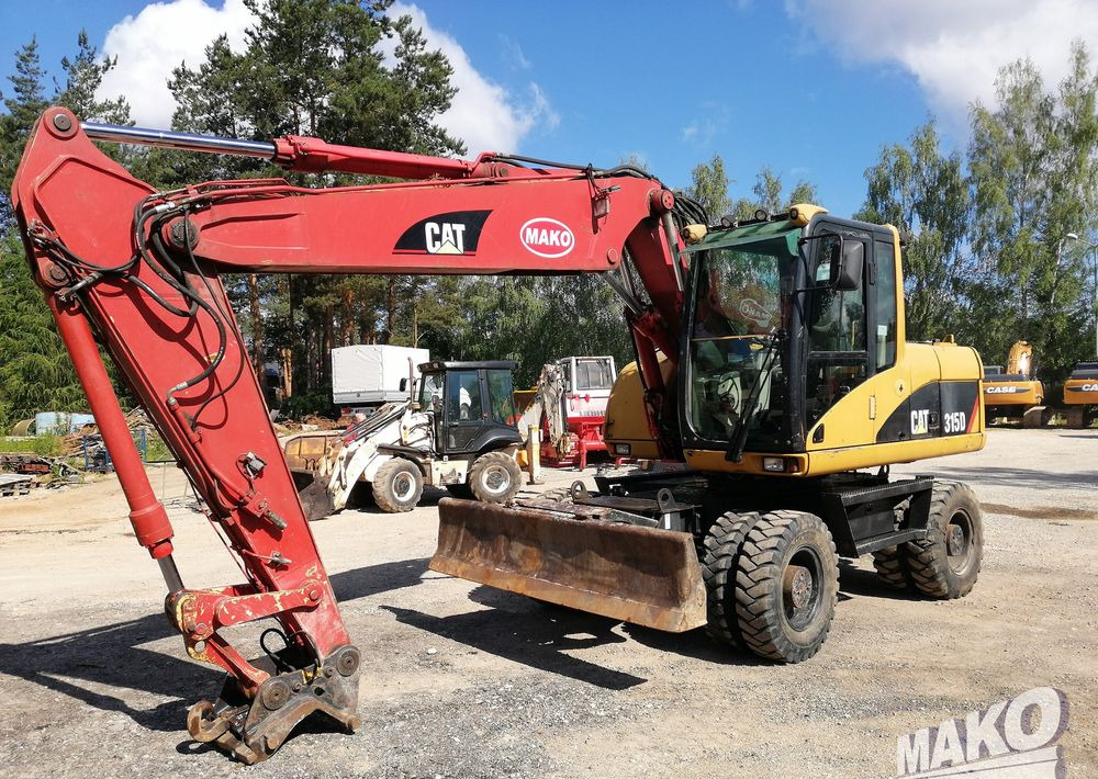 Caterpillar M315 C - Excavadora de ruedas: foto 1 Caterpillar M315 C - Excavadora de ruedas: foto 1
