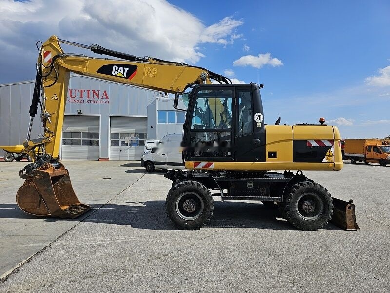 Caterpillar M315D - Excavadora de ruedas: foto 1 Caterpillar M315D - Excavadora de ruedas: foto 1