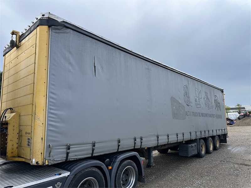 Schmitz Cargobull Machine transport trailer with bag ramp - Semirremolque góndola rebajadas: foto 1 Schmitz Cargobull Machine transport trailer with bag ramp - Semirremolque góndola rebajadas: foto 1