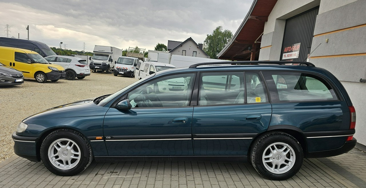 Opel Omega B 2,5 v6 *automat* napęd tył *welury* - Coche familiar: foto 4 Opel Omega B 2,5 v6 *automat* napęd tył *welury* - Coche familiar: foto 4