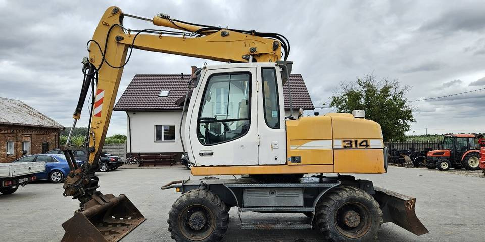 Koparka kołowa Liebherr A314 Litronic 9350 h 4 łyżki kołówka - Excavadora de ruedas: foto 1 Koparka kołowa Liebherr A314 Litronic 9350 h 4 łyżki kołówka - Excavadora de ruedas: foto 1