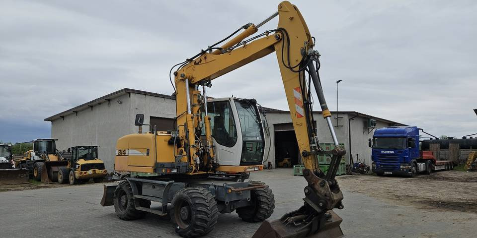 Koparka kołowa Liebherr A314 Litronic 9350 h 4 łyżki kołówka - Excavadora de ruedas: foto 4 Koparka kołowa Liebherr A314 Litronic 9350 h 4 łyżki kołówka - Excavadora de ruedas: foto 4