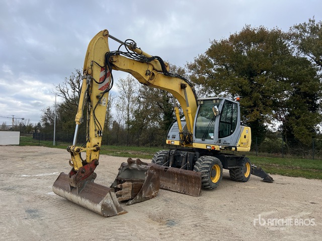 2008 New Holland MH City Pelle Sur Pneus Wheel Excavator - Excavadora de ruedas: foto 1 2008 New Holland MH City Pelle Sur Pneus Wheel Excavator - Excavadora de ruedas: foto 1
