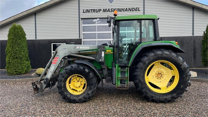 Tractor John Deere 6506 Med frontlæsser og vendegear ved rattet: foto 1